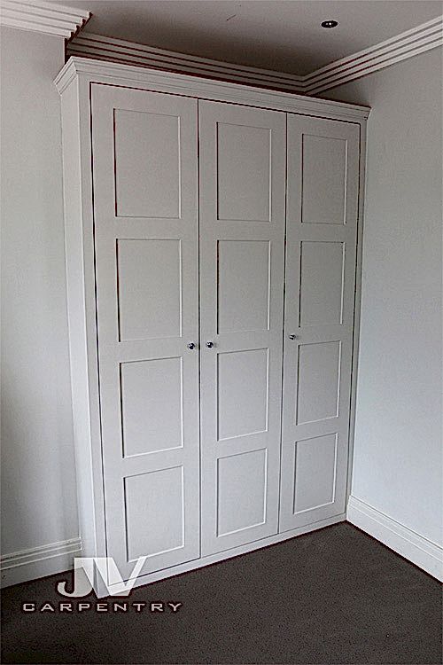 Fitted wardrobe with panneled doors